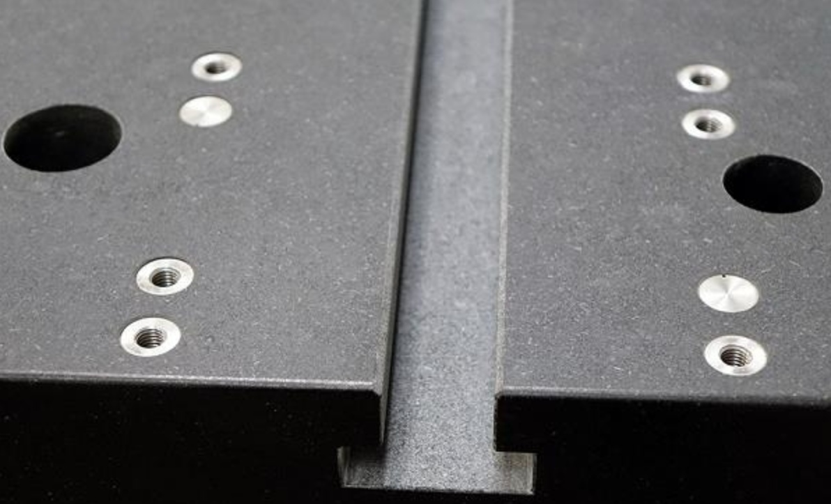 Precision granite machining with inserts, T-slots, holes, and airways